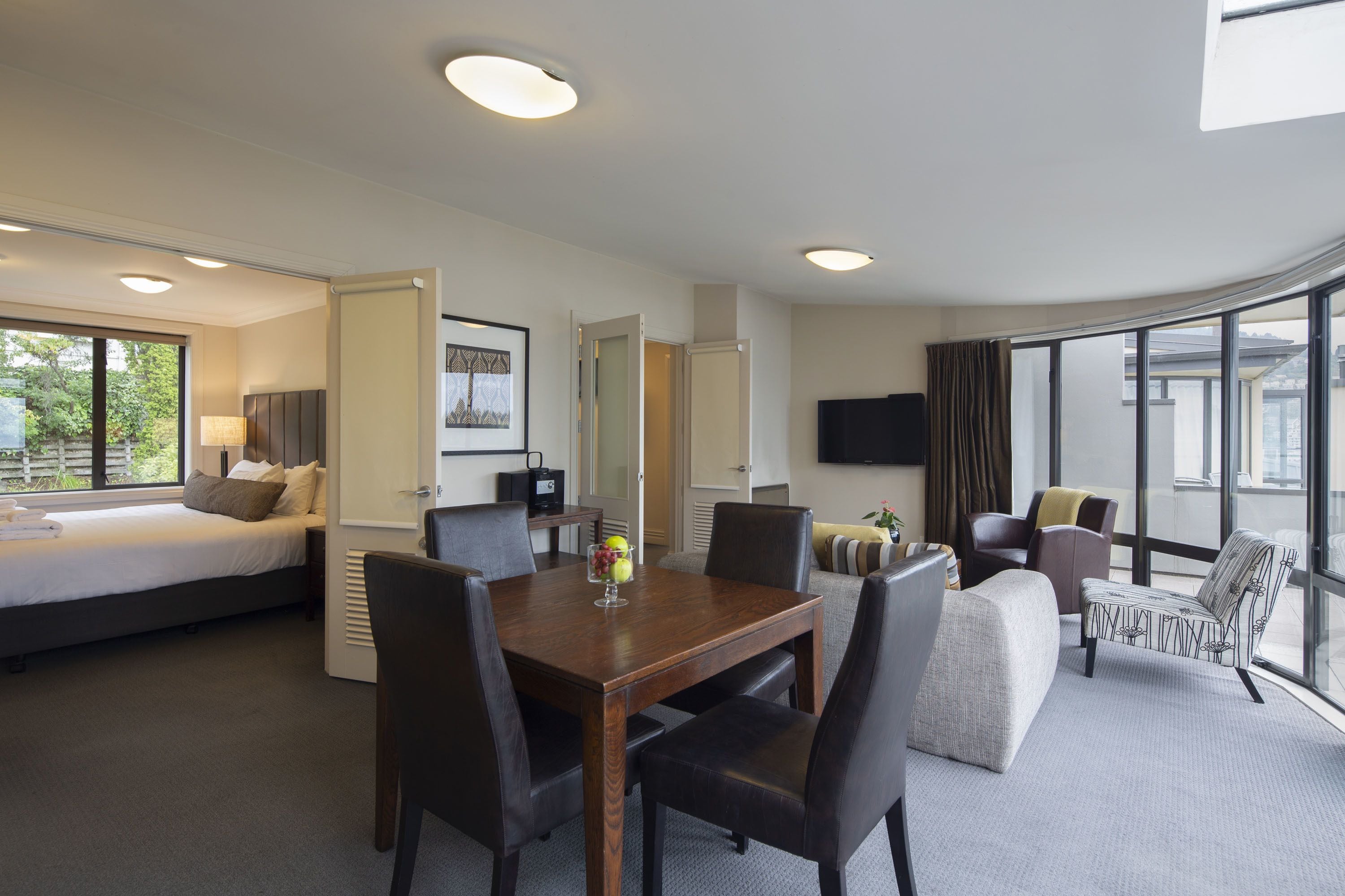 Premium bedding, desk, laptop workspace, iron/ironing board