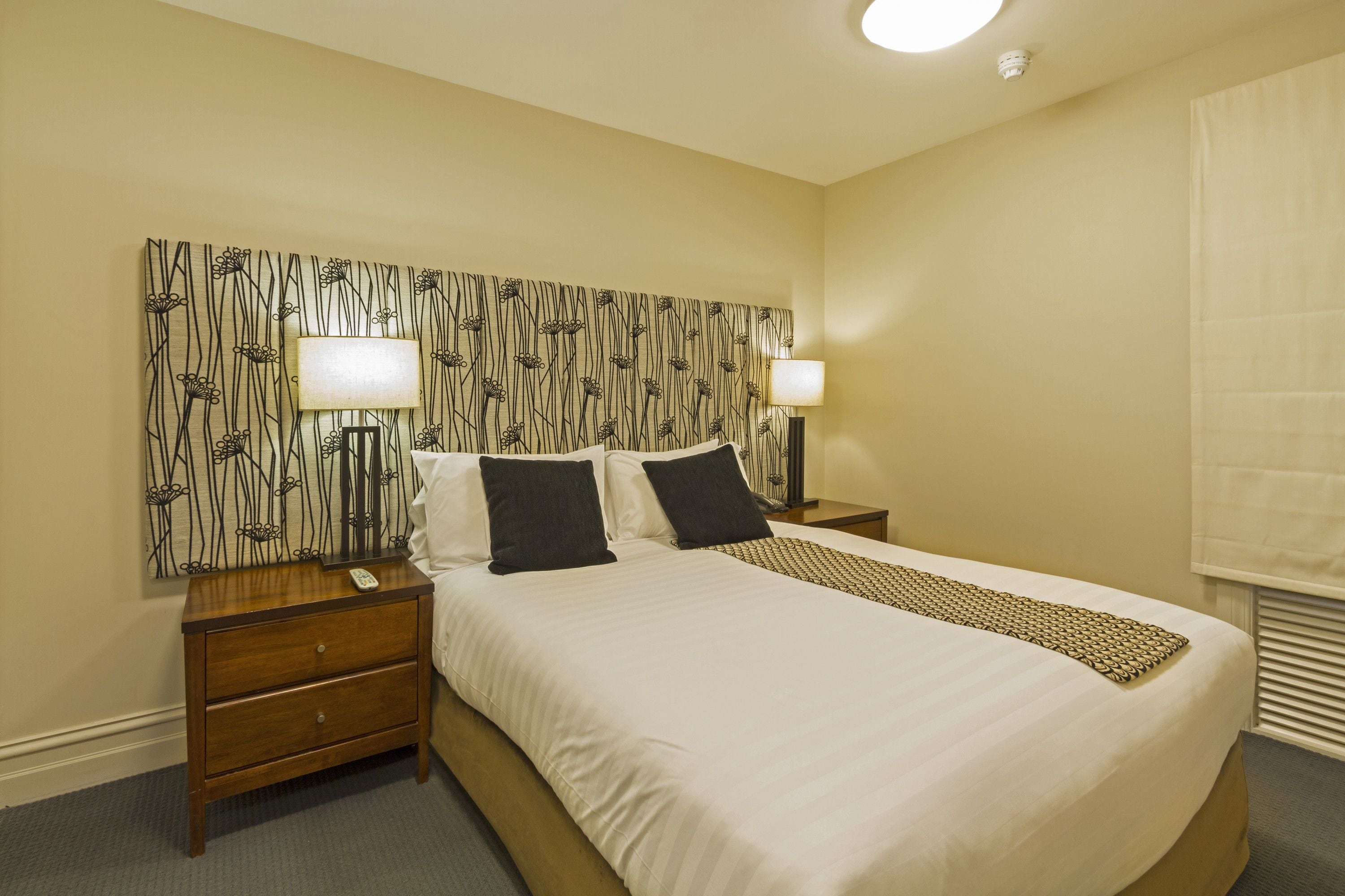 Premium bedding, desk, laptop workspace, iron/ironing board