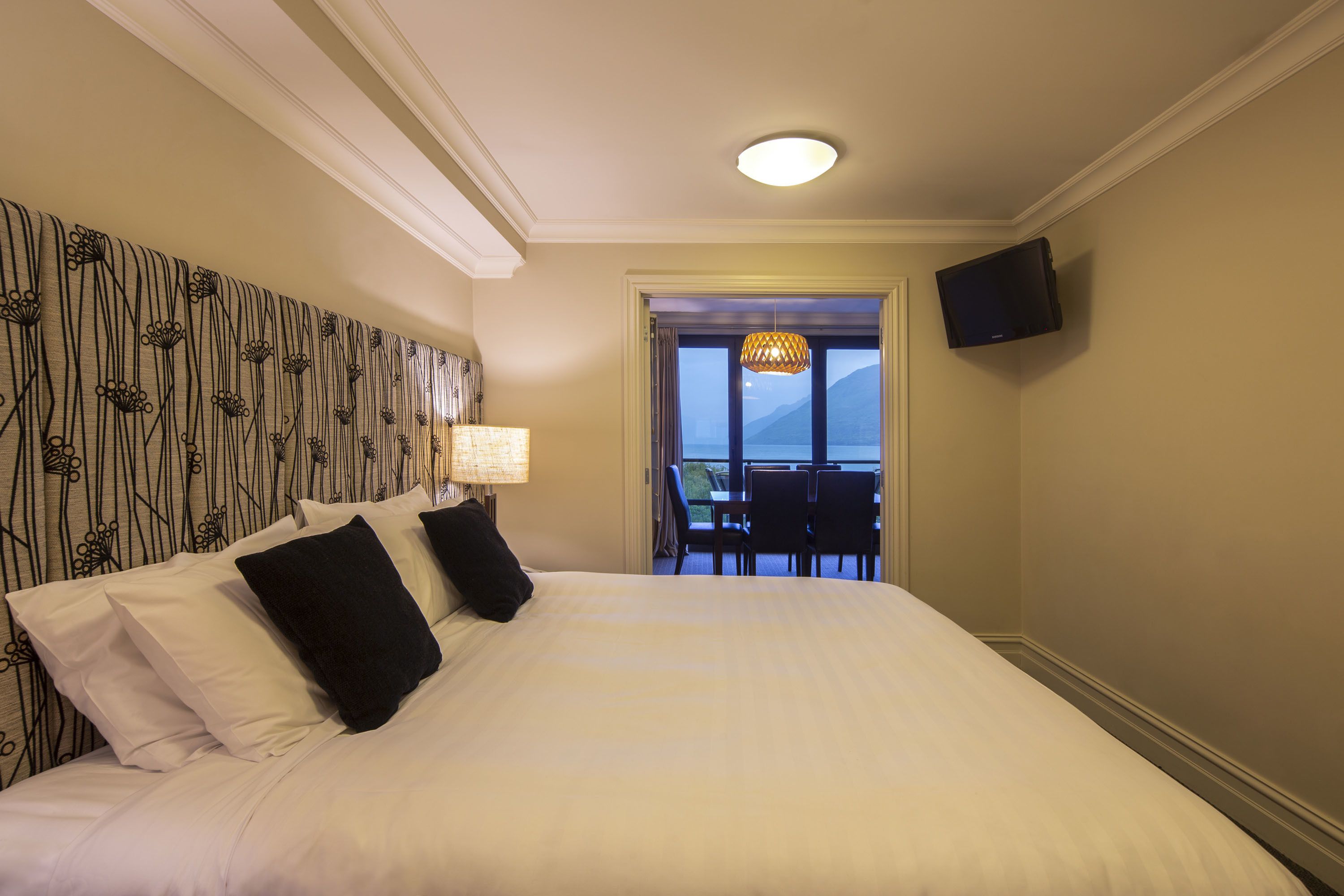 Premium bedding, desk, laptop workspace, iron/ironing board