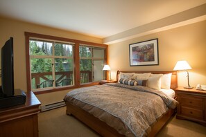 One-bedroom condo with den | Premium bedding, iron/ironing board, cribs/infant beds, rollaway beds - Solitude Condominiums (Solitude)