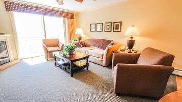 Deluxe Room, 2 Bedrooms | Living room | Flat-screen TV, fireplace, DVD player