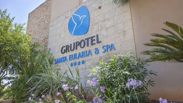 A sign for Grupotel Santa Eularia & Spa with a logo and name.
