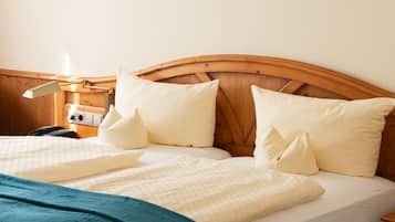 Comfort Triple Room | Minibar, in-room safe, desk, blackout drapes
