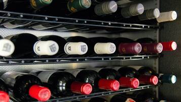 A wine rack with various bottles of wine.