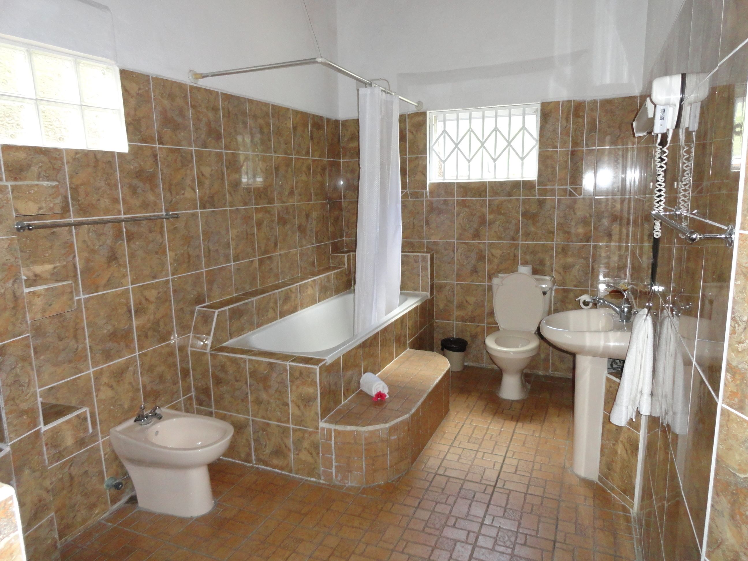 grand villa, 2 bedrooms, beach view | bathroom | free toiletries, hair dryer, towels
