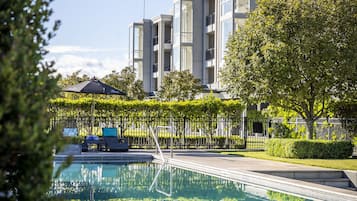 Outdoor pool, a heated pool, sun loungers