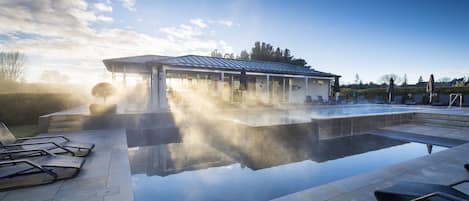 Outdoor pool, a heated pool, pool loungers