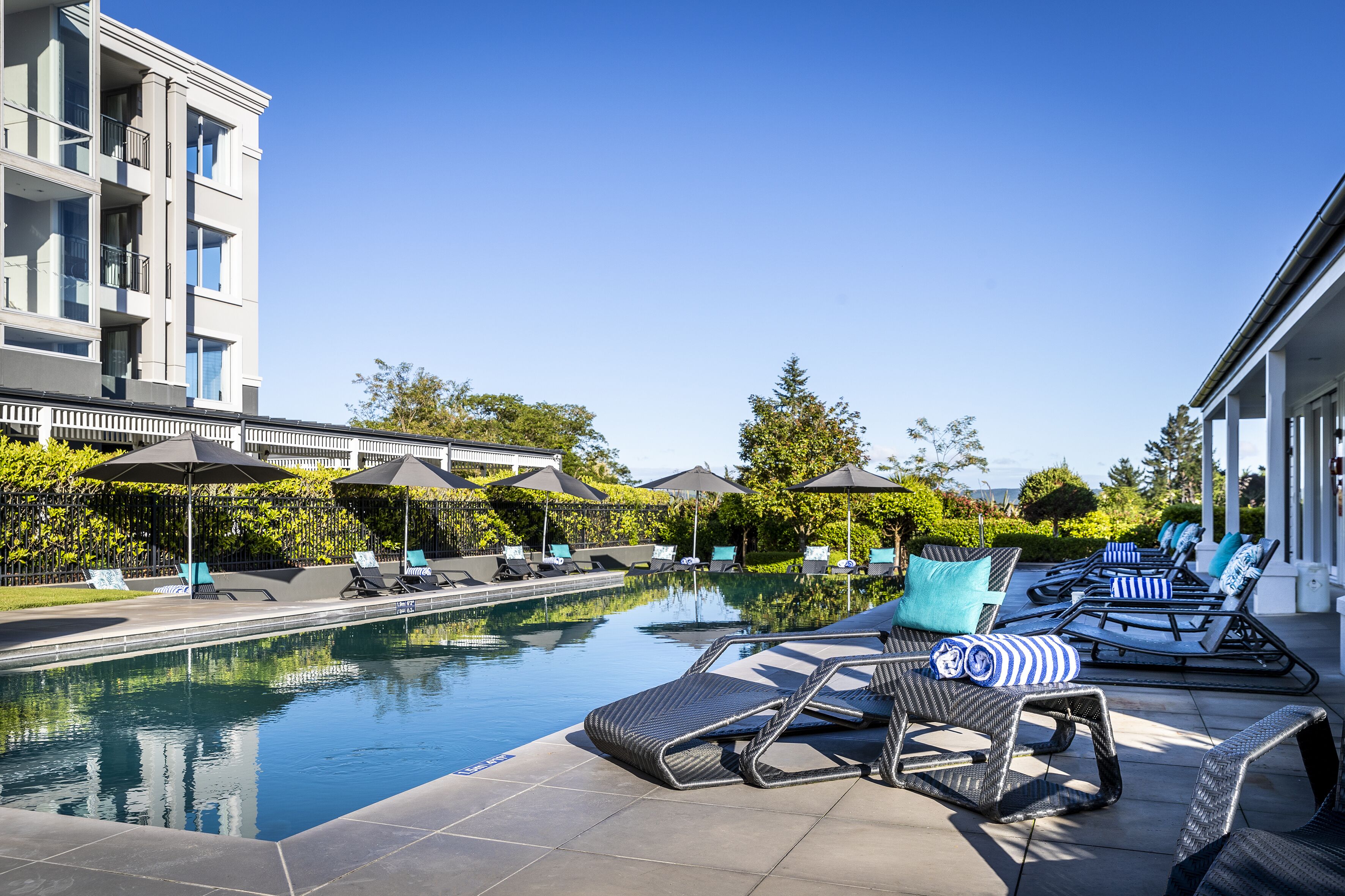 outdoor pool, a heated pool, pool loungers