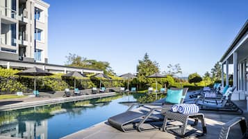 Outdoor pool, a heated pool, pool loungers