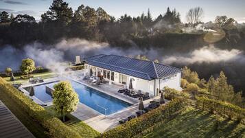 Outdoor pool, a heated pool, pool loungers