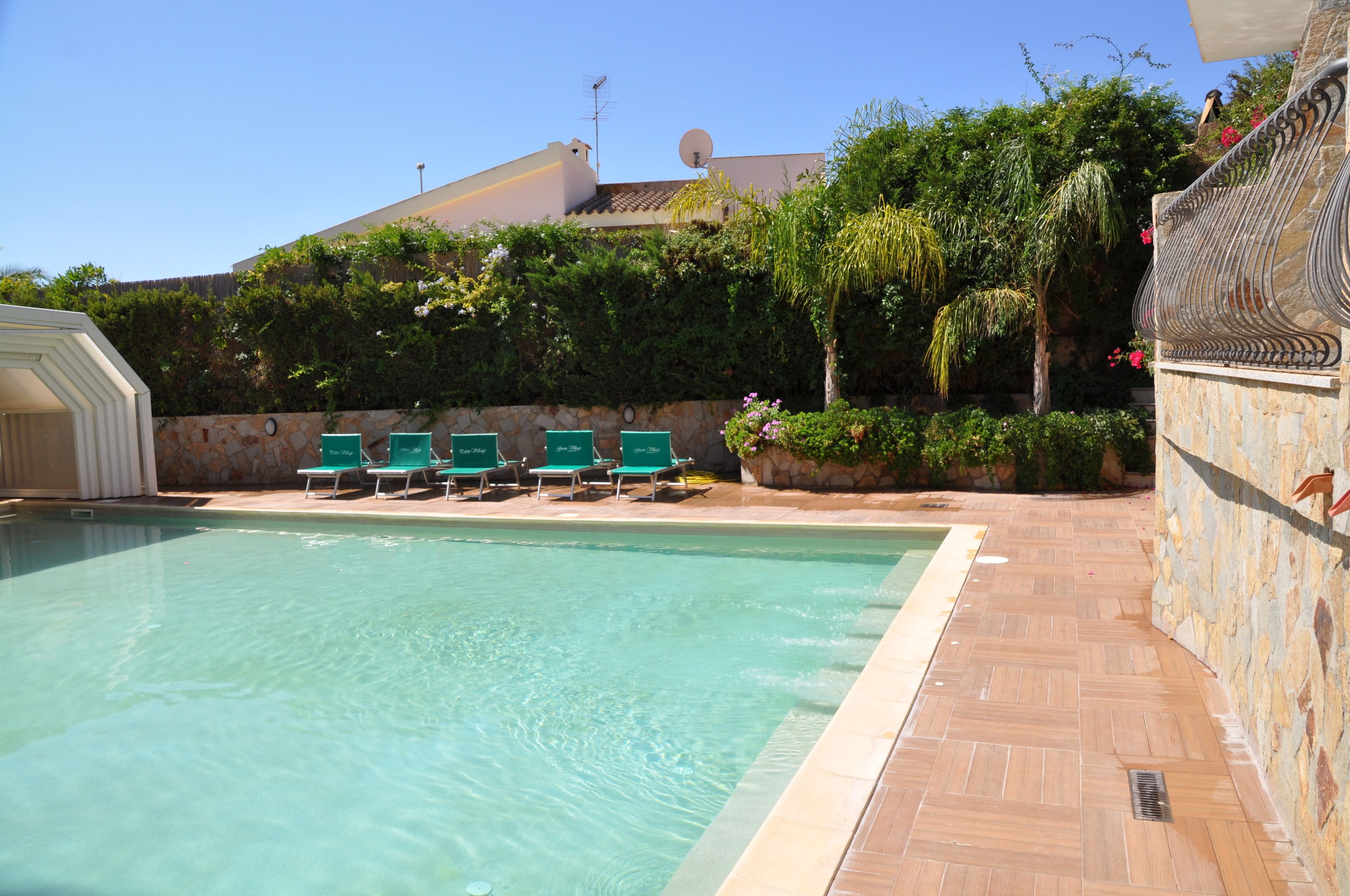 outdoor pool, pool umbrellas, pool loungers