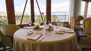 Breakfast, lunch, dinner served; Mediterranean cuisine, sea views 