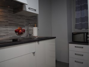 Apartament familiar, diversos llits, edifici annex | Cuina privada