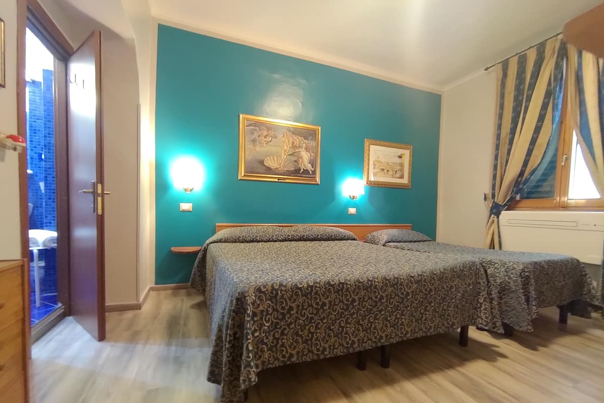 Triple Room | Premium bedding, in-room safe, blackout drapes, iron/ironing board