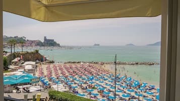On the beach, sun loungers, beach towels