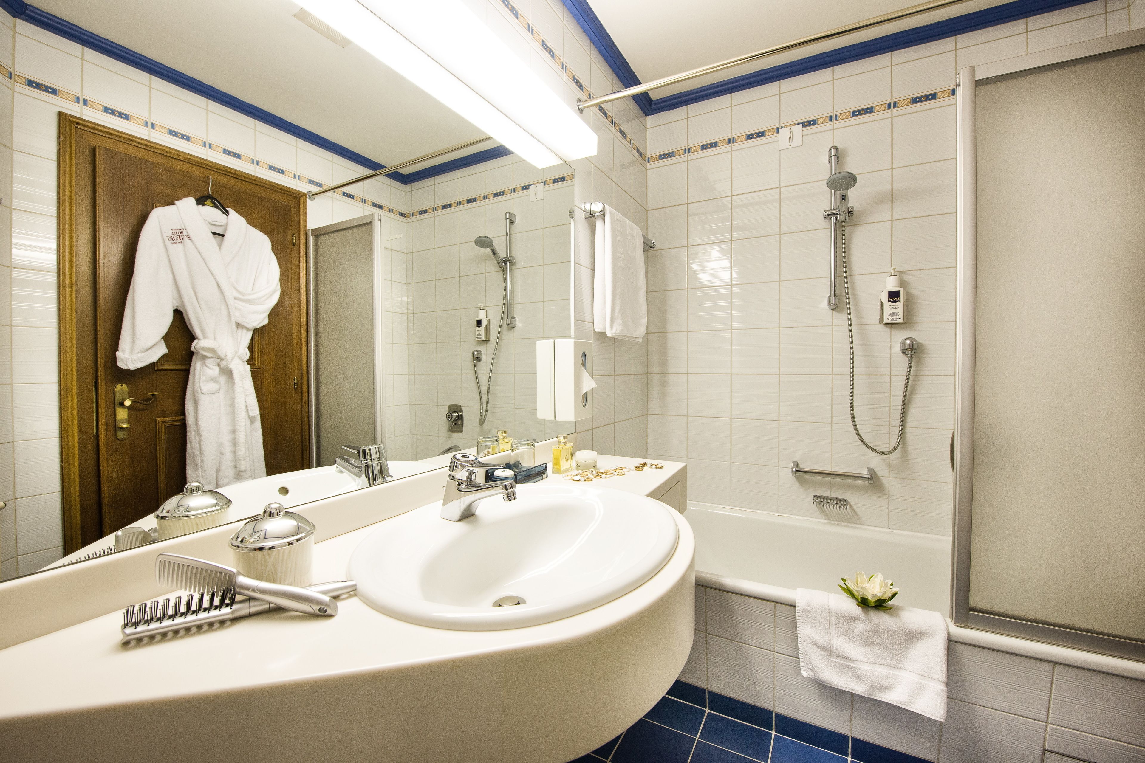 hair dryer, dressing gowns, slippers, towels