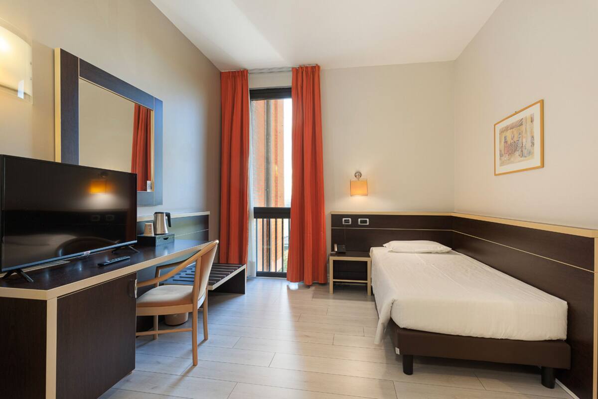Camera Deluxe con Letto alla Francese | Dundyner, minibar, safe på rommet og skrivebord