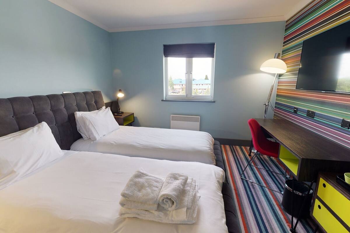 Desk, laptop workspace, blackout curtains, iron/ironing board