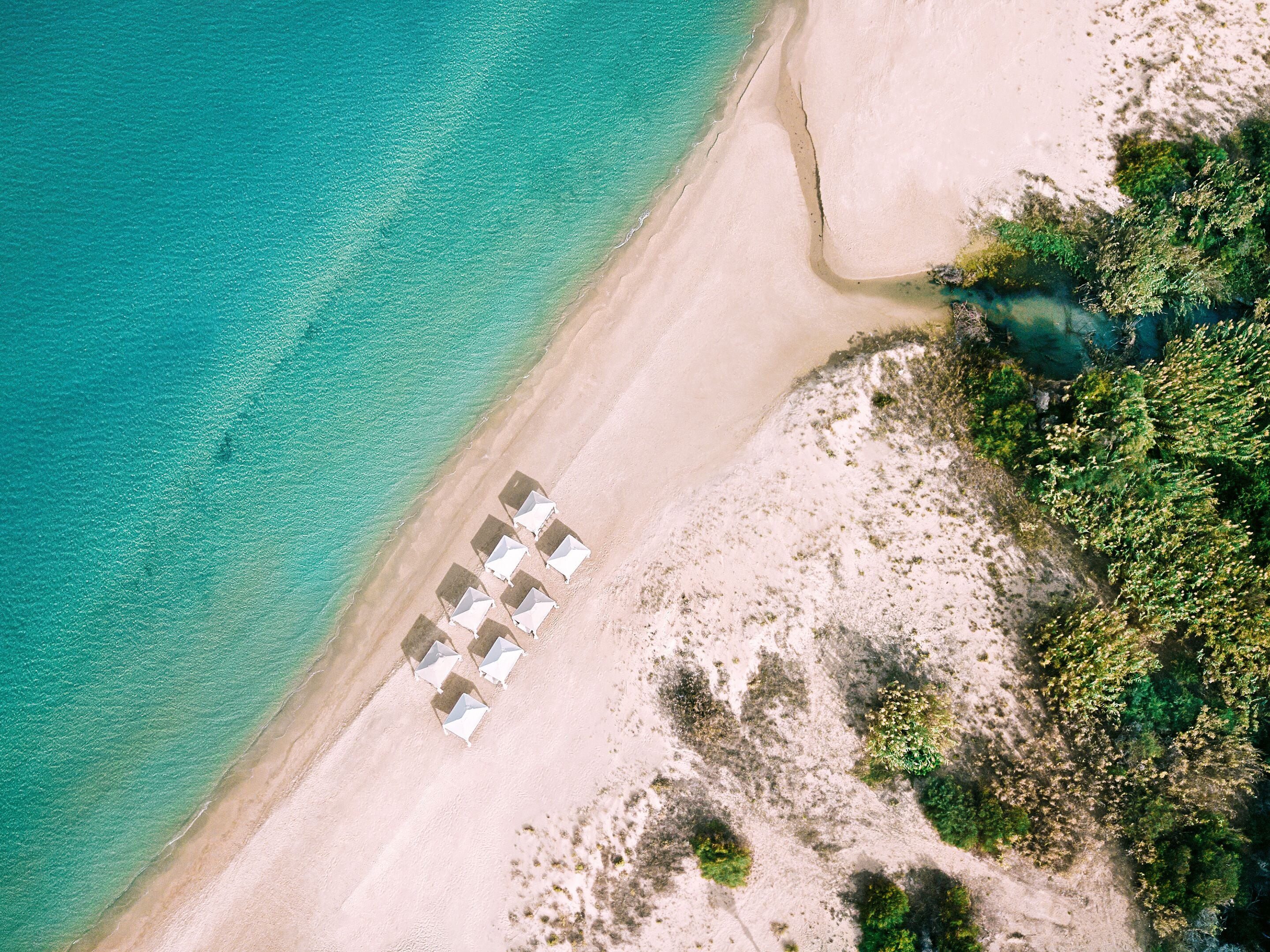 Beach umbrellas, beach towels, waterskiing, windsurfing