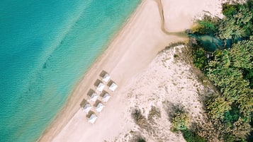 Beach umbrellas, beach towels, waterskiing, windsurfing