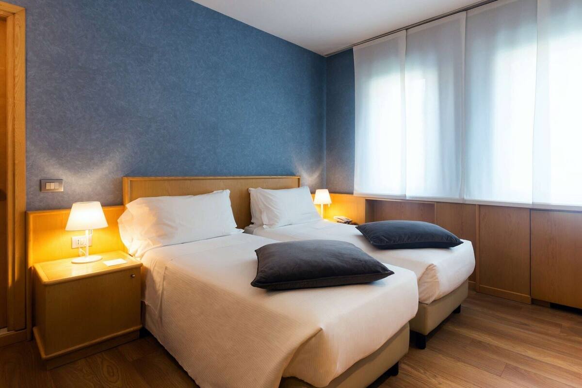 Premium bedding, down comforters, Select Comfort beds, minibar