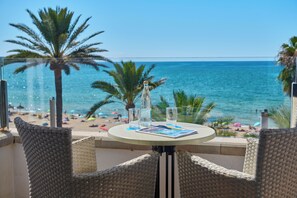 Double Room, Balcony, Sea View | Minibar, in-room safe, desk, laptop workspace