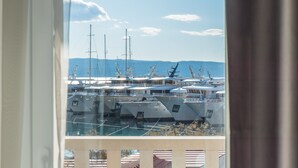 A marina with multiple yachts docked. - Hotel Krilo (Dugi Rat)