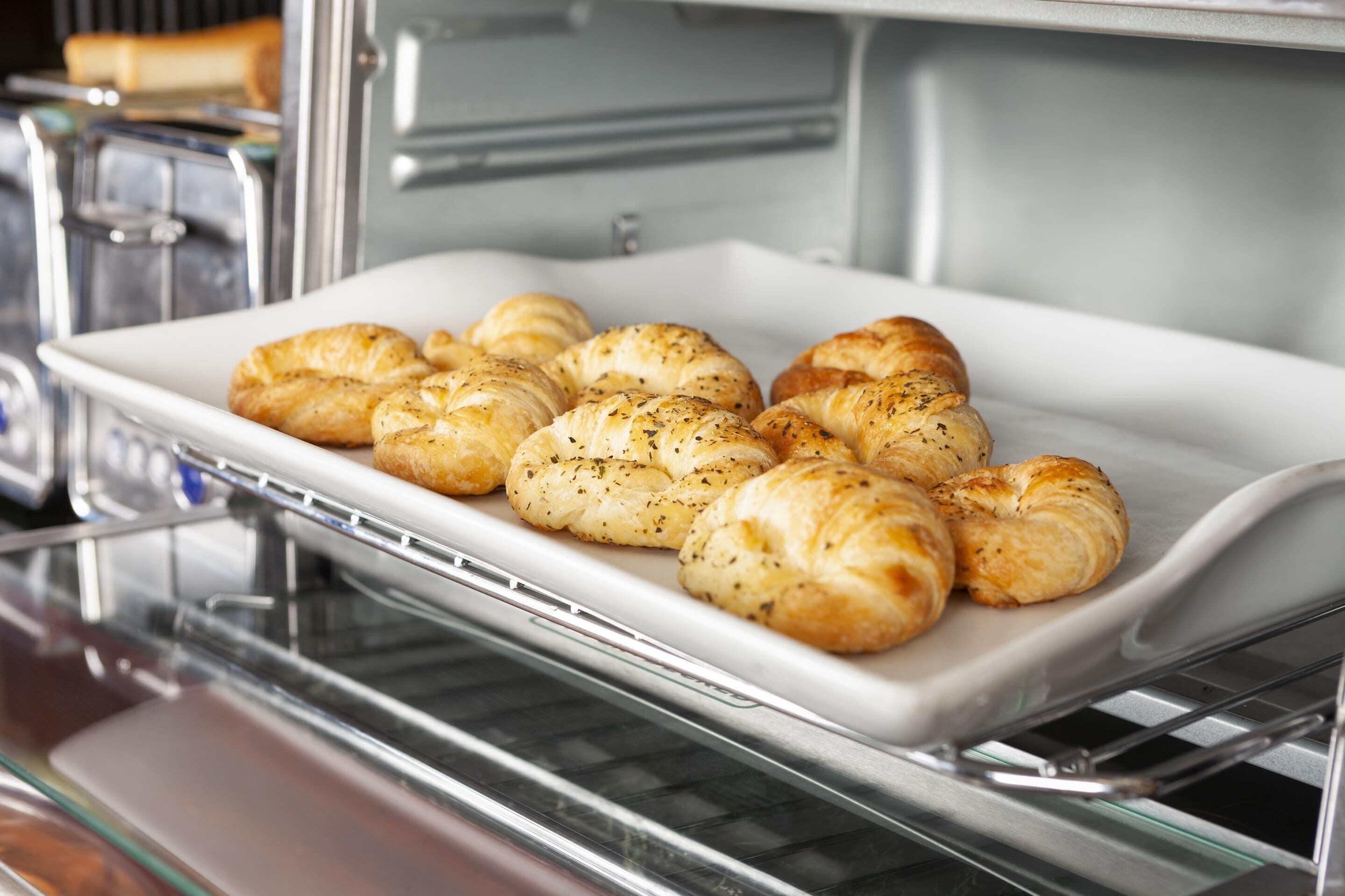 A tray of baked goods in an oven.