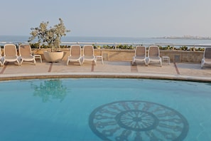 Outdoor pool, open 8:00 AM to 8:00 PM, pool umbrellas, sun loungers