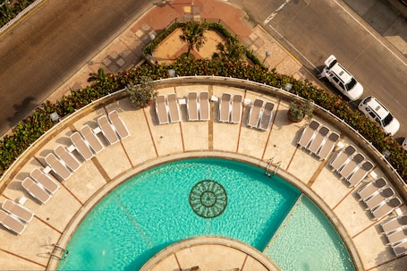 Outdoor pool, open 8:00 AM to 8:00 PM, pool umbrellas, sun loungers