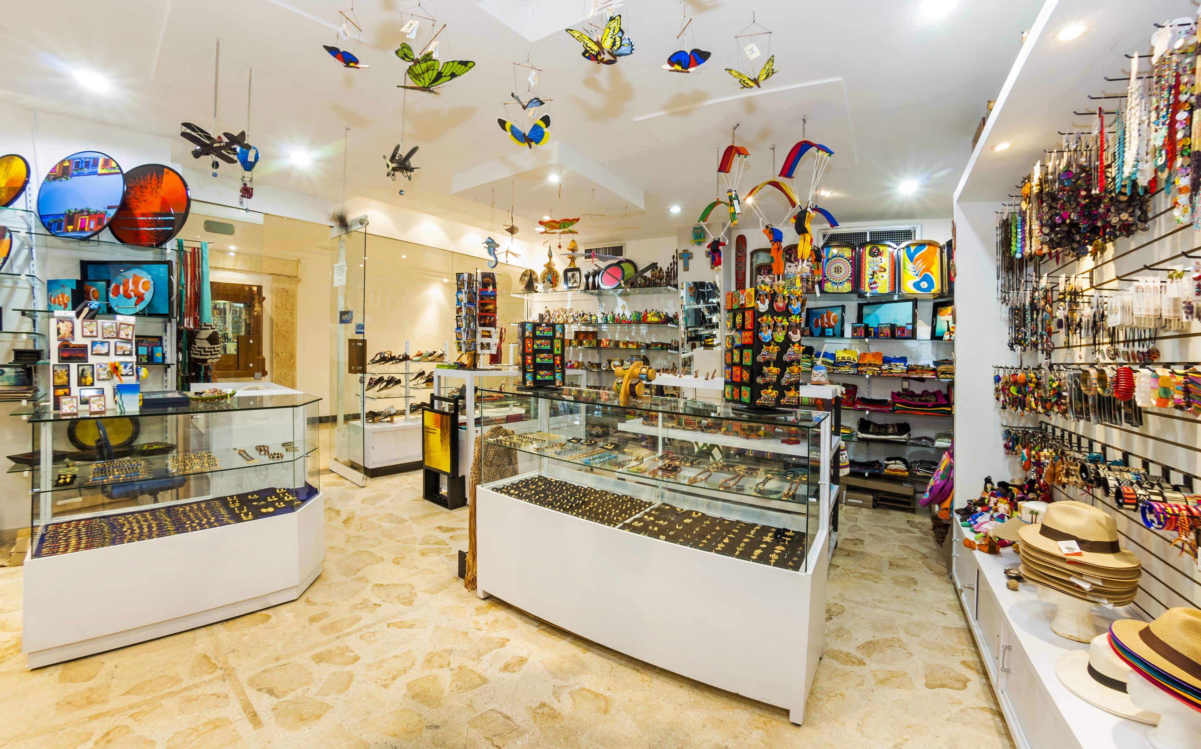 A jewelry store with glass display cases and a variety of items on shelves.