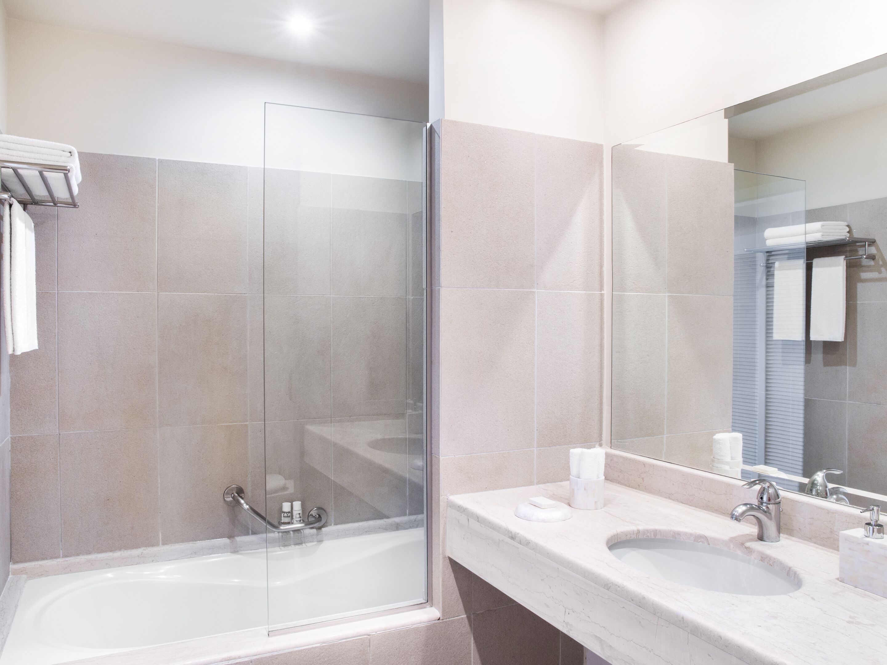luxury guestroom sea view | bathroom | bathtub, hair dryer, towels