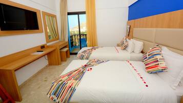 A hotel room with two beds, a desk, a TV, and a balcony with a view.