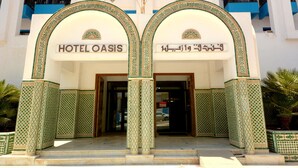 The entrance of Oasis Hotel & Spa with traditional Arabic calligraphy and geometric patterns. - Oasis Hôtel & Spa (Agadir)