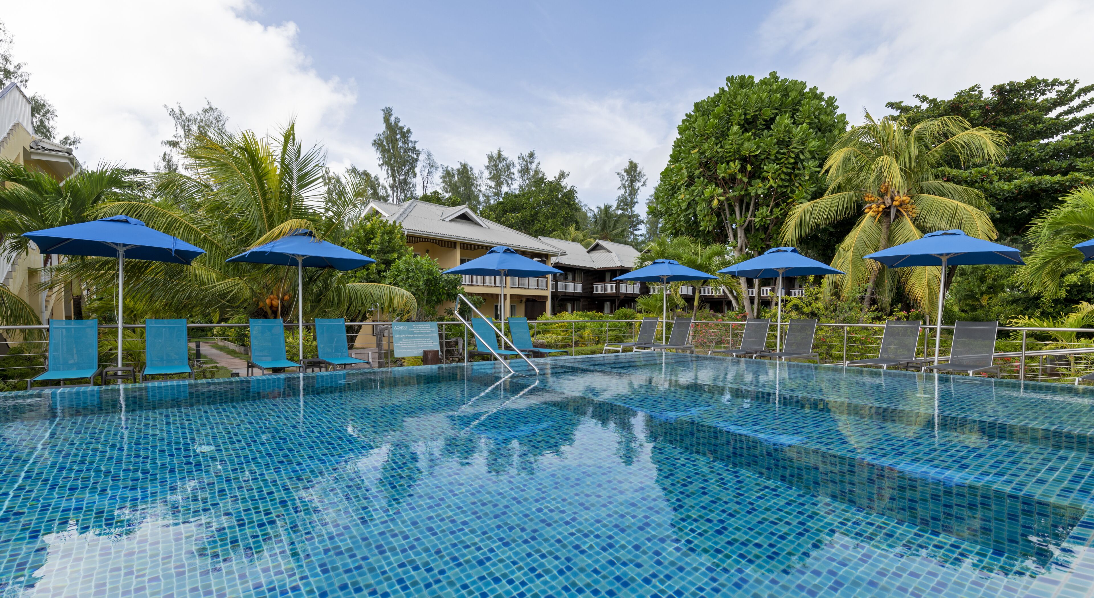 outdoor pool, pool umbrellas, pool loungers