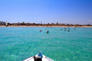 Private beach, white sand, beach towels, waterskiing