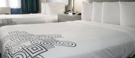 Premium bedding, individually furnished, blackout curtains