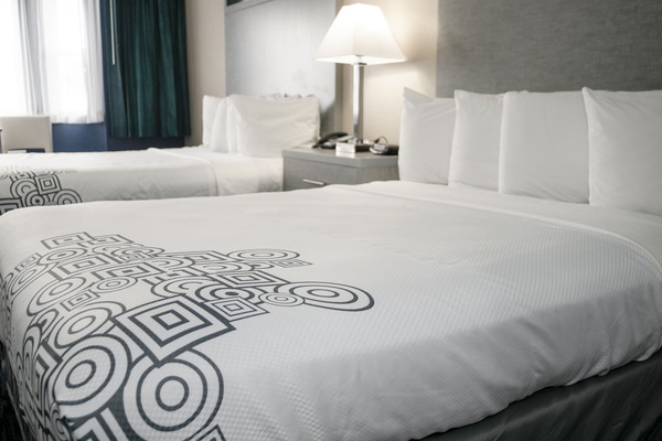 Premium bedding, individually furnished, blackout drapes