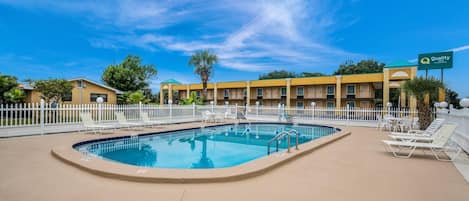 Outdoor pool, open 8:00 AM to 7:00 PM, pool loungers