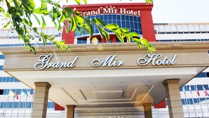 The Grand Mir Hotel entrance with a clear view of the building's facade and signage. - Grand Mir Hotel (Tashkent)