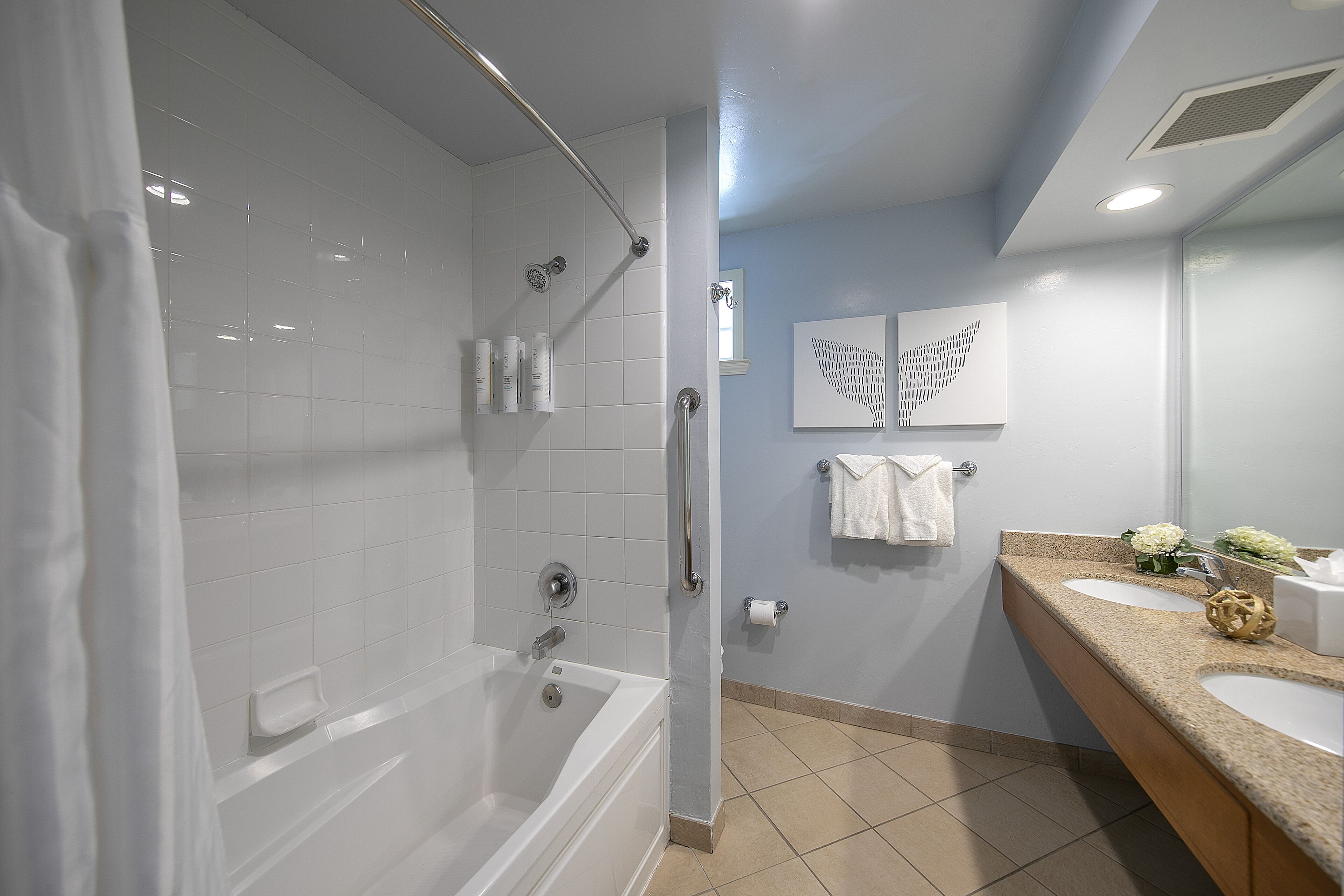 combined shower/bathtub, designer toiletries, hair dryer, bathrobes