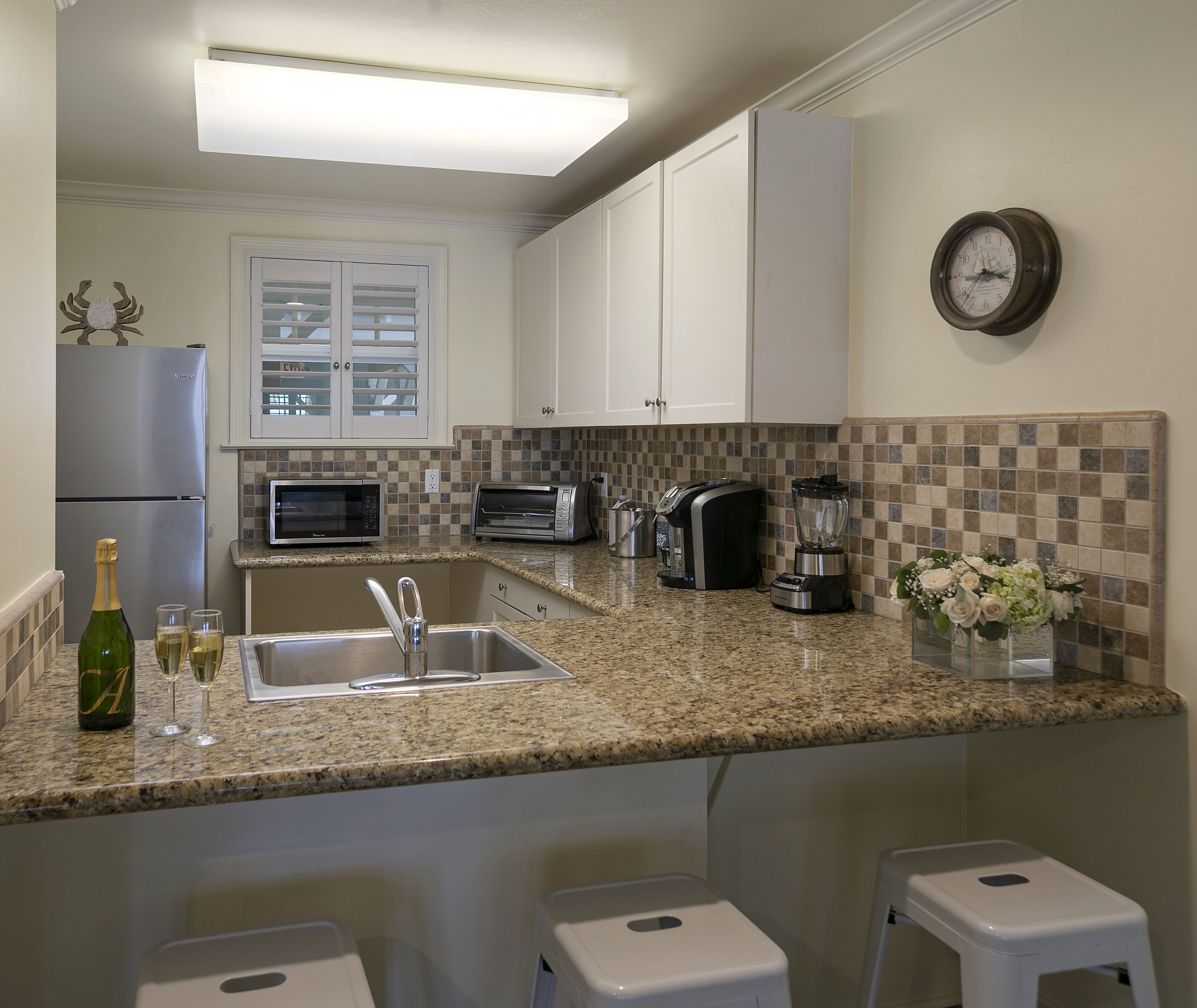 fridge, coffee/tea maker, cookware/dishes/utensils