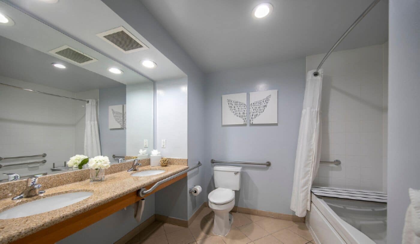 superior suite, multiple beds (oceanview suite, two queens ada) | bathroom | combined shower/bathtub, designer toiletries, hair dryer, bathrobes
