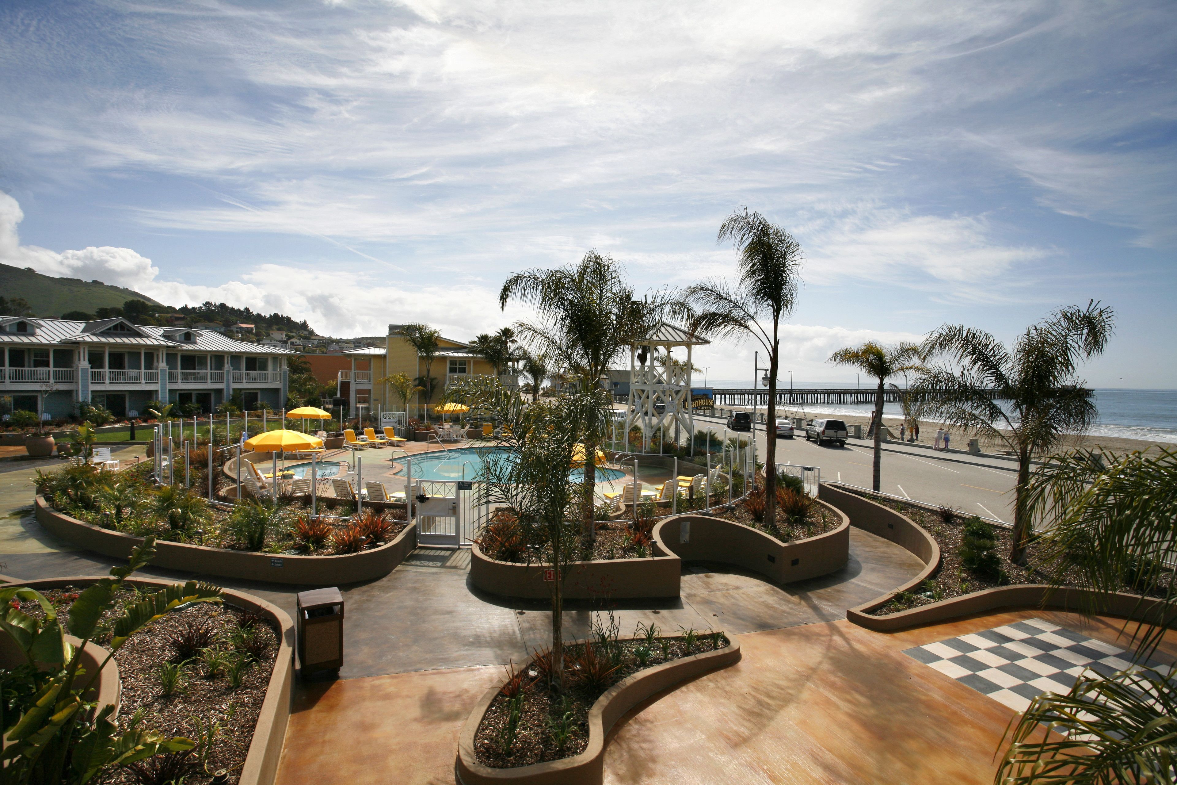 outdoor pool, open 8:00 am to 10:00 pm, pool umbrellas, pool loungers