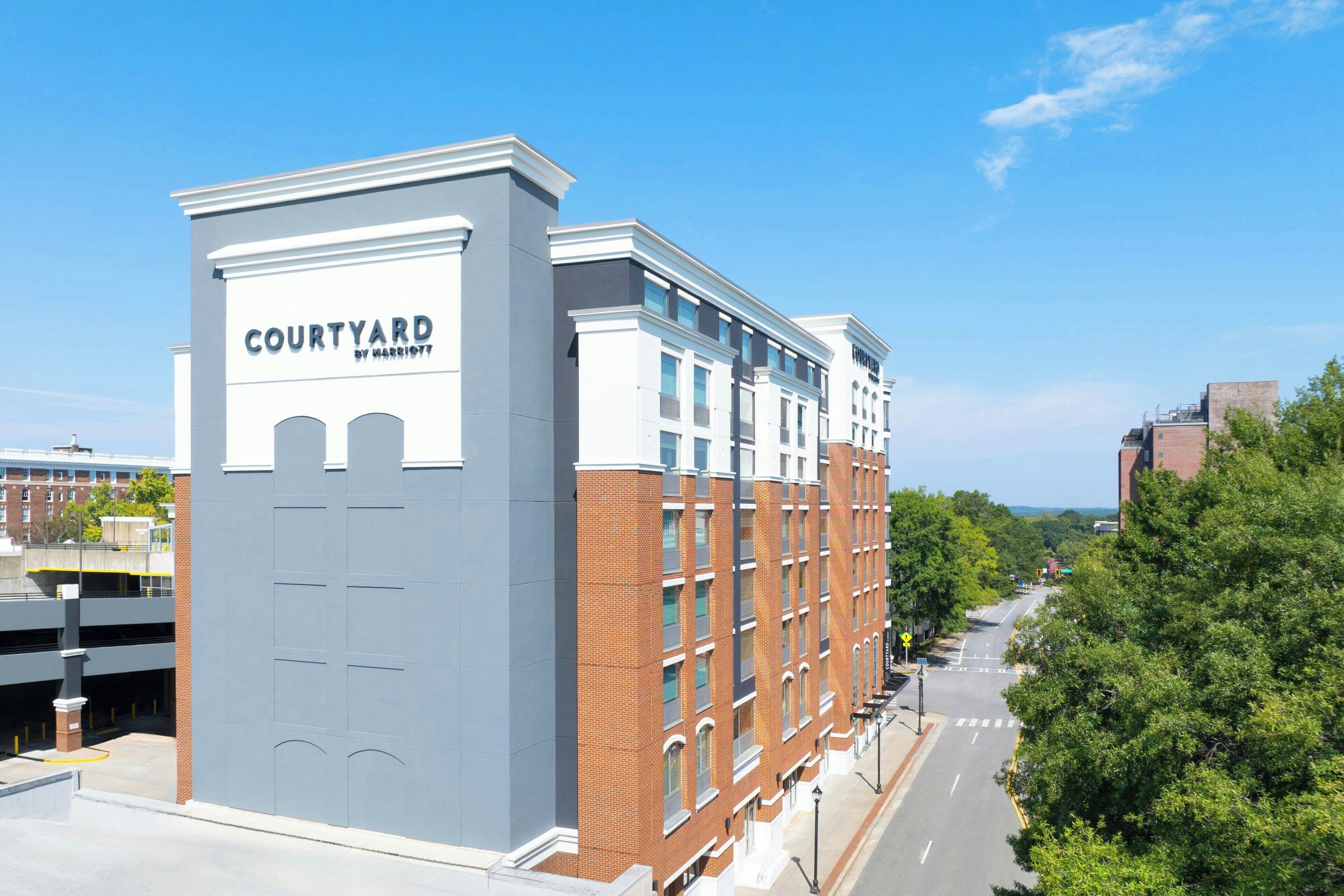 A multi-story building with a sign reading "Courtyard by Marriott."