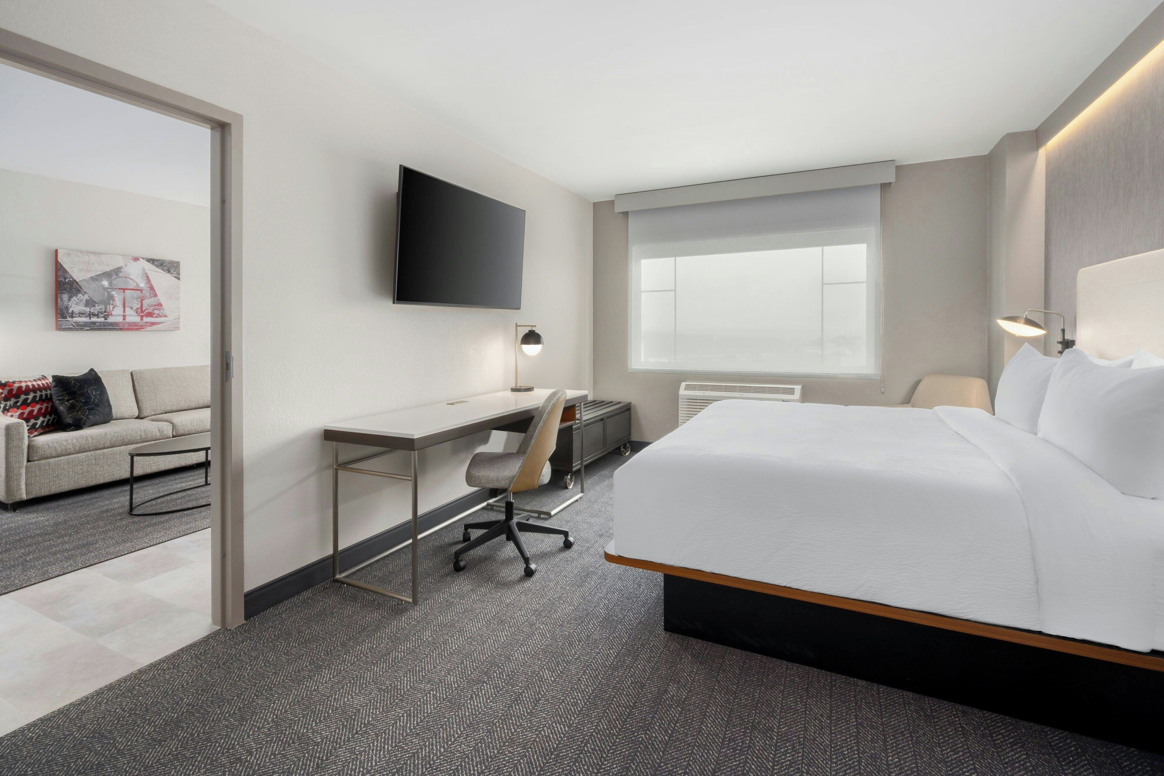 suite, 1 bedroom | hypo-allergenic bedding, desk, laptop workspace, iron/ironing board