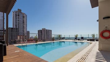 Outdoor pool, open 7:00 AM to 10:00 AM, pool umbrellas, sun loungers