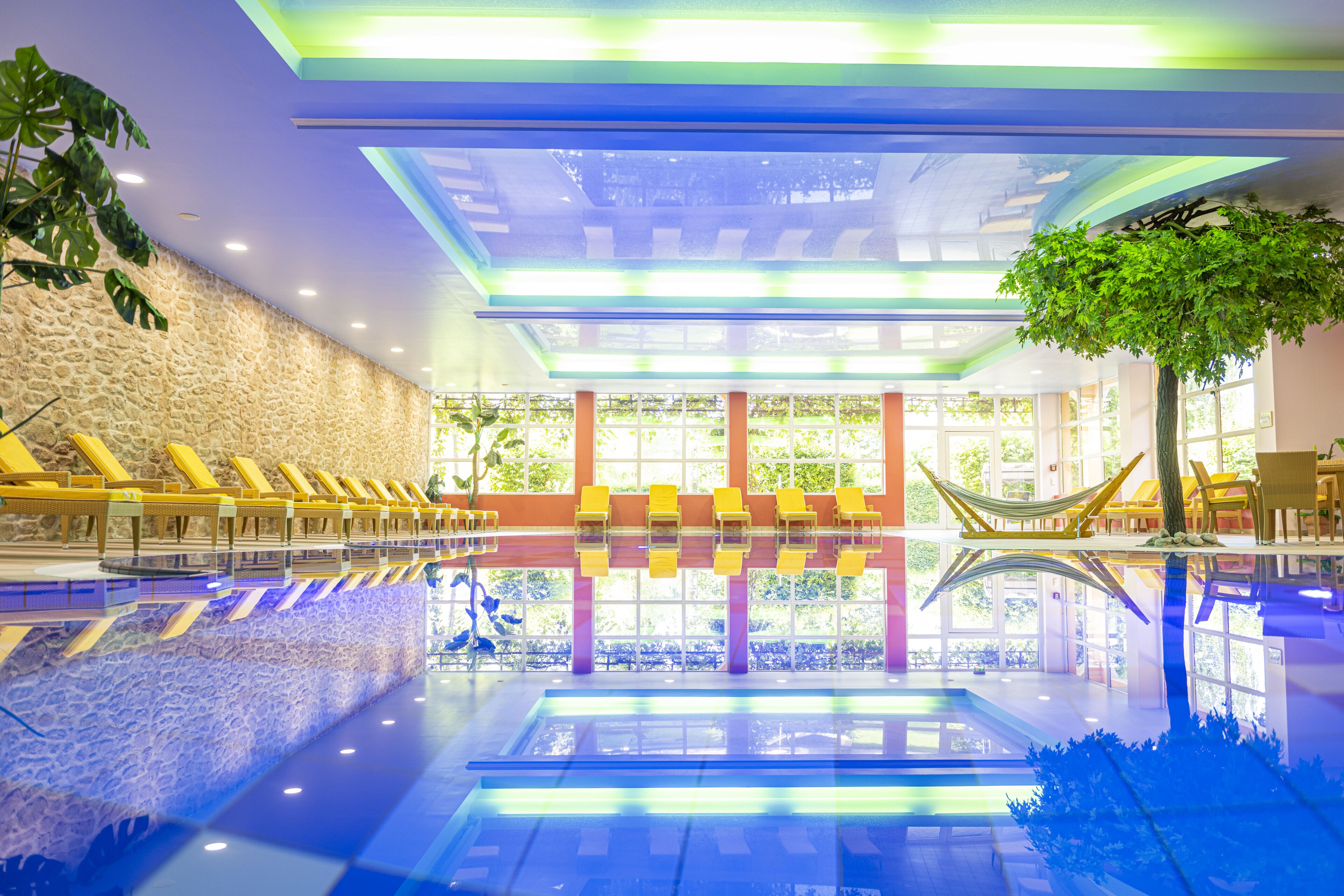 Indoor pool, pool umbrellas, pool loungers