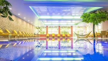 Indoor pool, pool umbrellas, pool loungers