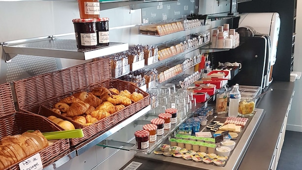 A breakfast buffet with various pastries, sandwiches, and condiments. - Brit Hotel Confort Montpellier Parc Expositions (Perols)